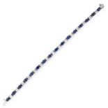 A SAPPHIRE AND DIAMOND LINE BRACELET in 14ct white gold, set with a row of sixteen oval cut blue