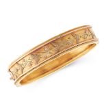 AN ANTIQUE CUFF BANGLE, LATE 19TH CENTURY in yellow gold, the band half decorated with engraved