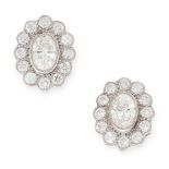 A PAIR OF DIAMOND CLUSTER STUD EARRINGS in 18ct white gold, each set with an oval cut diamond within