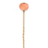 TWO ANTIQUE CORAL TIE / STICK PINS in yellow gold, each one set at the end with a polished coral
