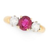 A RUBY AND DIAMOND THREE STONE RING in 18ct yellow gold, set with an oval cut ruby of 1.35 carats