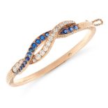 AN ANTIQUE SAPPHIRE AND DIAMOND BANGLE, LATE 19TH CENTURY in yellow gold, formed of interwoven