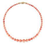 A CORAL BEAD NECKLACE in yellow gold, comprising a single row of fifty-five polished, graduated