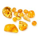 A MIXED LOT OF AMBER comprising a selection of various polished amber pieces and beads, the