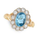 AN AQUAMARINE AND DIAMOND CLUSTER RING in 18ct yellow gold, set with an oval cut aquamarine of 1.