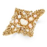 A VINTAGE PEARL BANGLE in 14ct yellow gold, set with an array of pearls within an array of