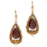 A PAIR OF ANTIQUE GARNET EARRINGS, 19TH CENTURY in yellow gold, each set with a pear shaped cabochon