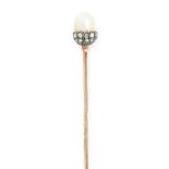 AN ANTIQUE NATURAL PEARL AND DIAMOND TIE / STICK PIN in yellow gold and silver, the pin surmounted
