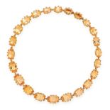 AN ANTIQUE IMPERIAL TOPAZ RIVIERE NECKLACE, 19TH CENTURY in high carat yellow gold, comprising a