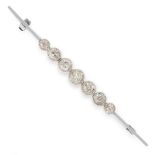AN ANTIQUE DIAMOND BAR BROOCH, EARLY 20TH CENTURY the bar set with a row of seven graduated old