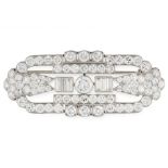 A DIAMOND BROOCH, KOCHERT in platinum, the openwork design set with a principal round cut diamond of