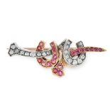 AN ANTIQUE RUBY AND DIAMOND BROOCH in high carat yellow gold, comprising of two horseshoe motifs