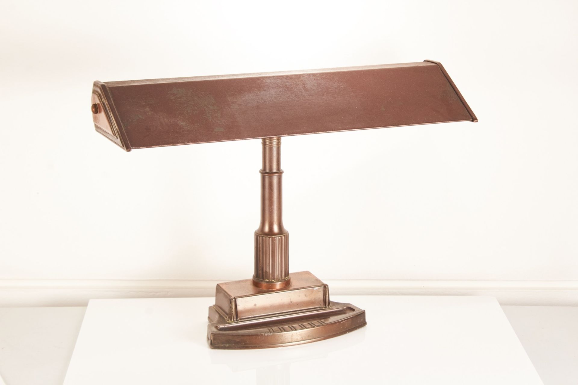 A 20th century American bronze effect banker’s lamp