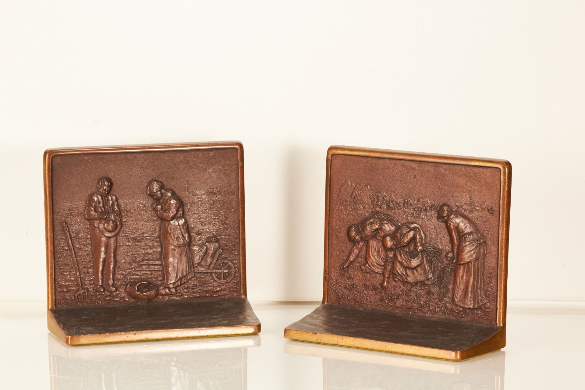 A pair of mid-20th century decorative bronze book ends