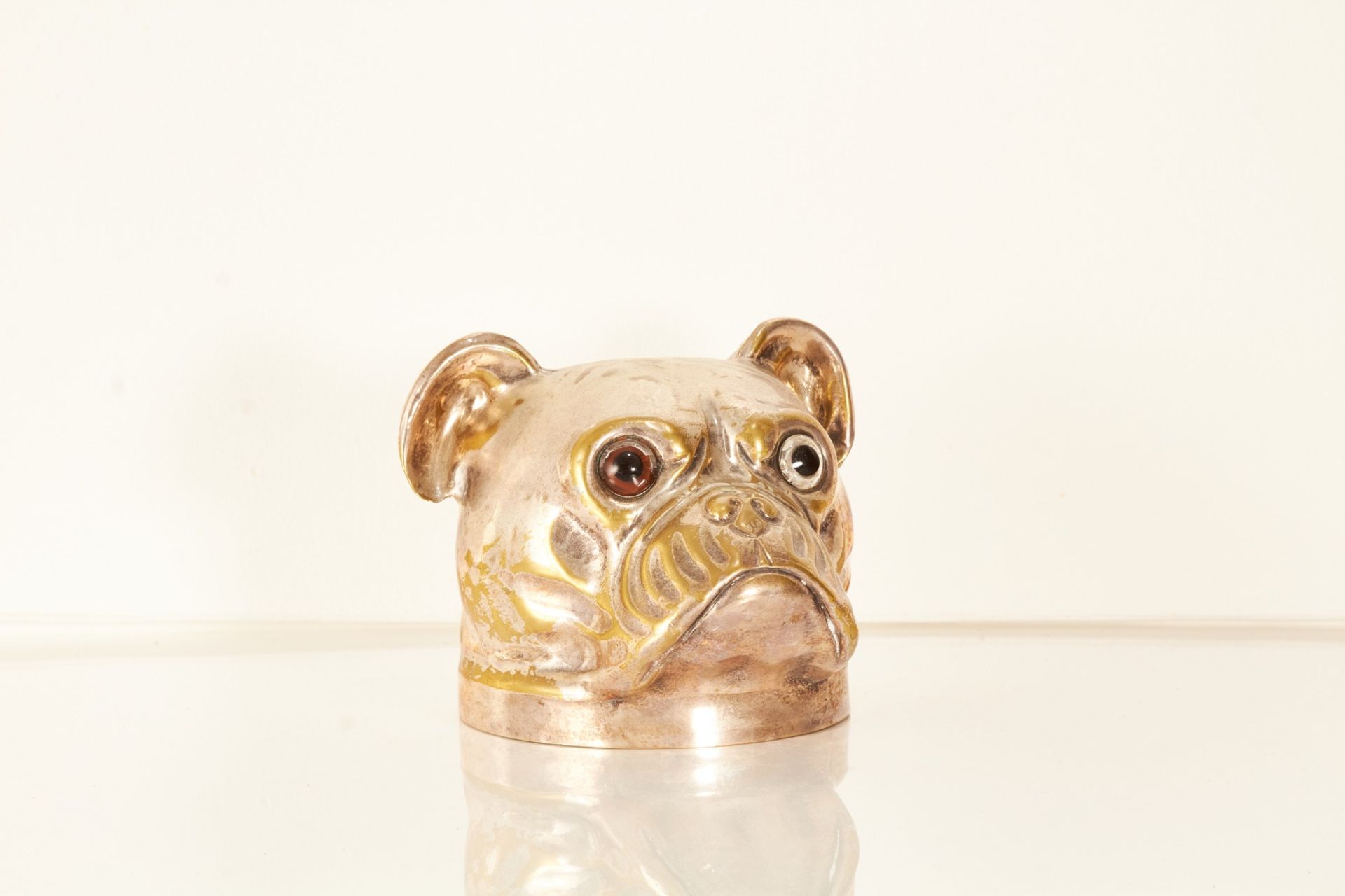 A silver-plated nickel novelty model of a pug’s head