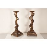 A pair of 20th century Chinese base metal candle stands