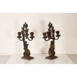 A pair of late 19th century French gilt bronze candlesticks, circa 1900