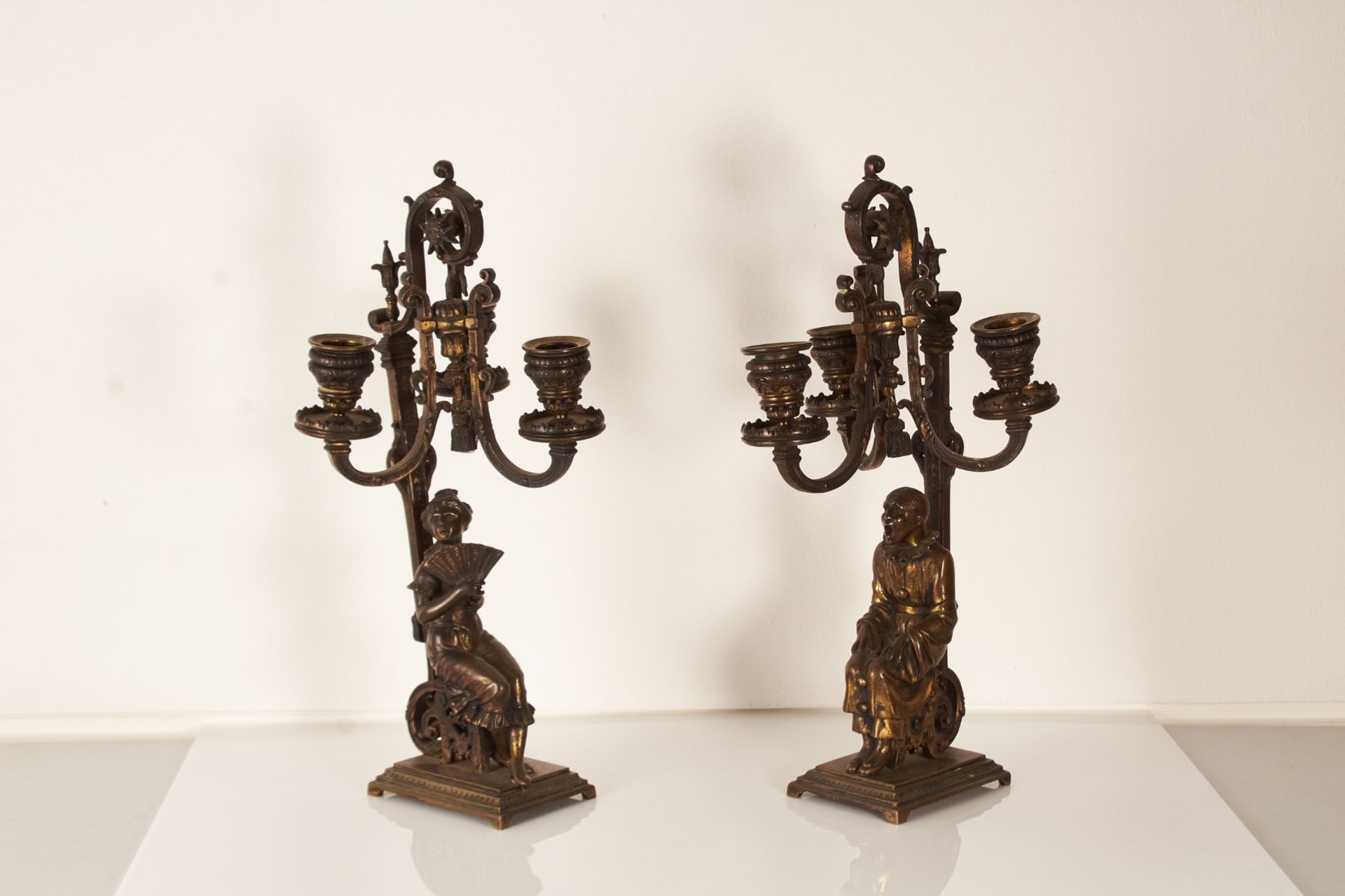 A pair of late 19th century French gilt bronze candlesticks, circa 1900