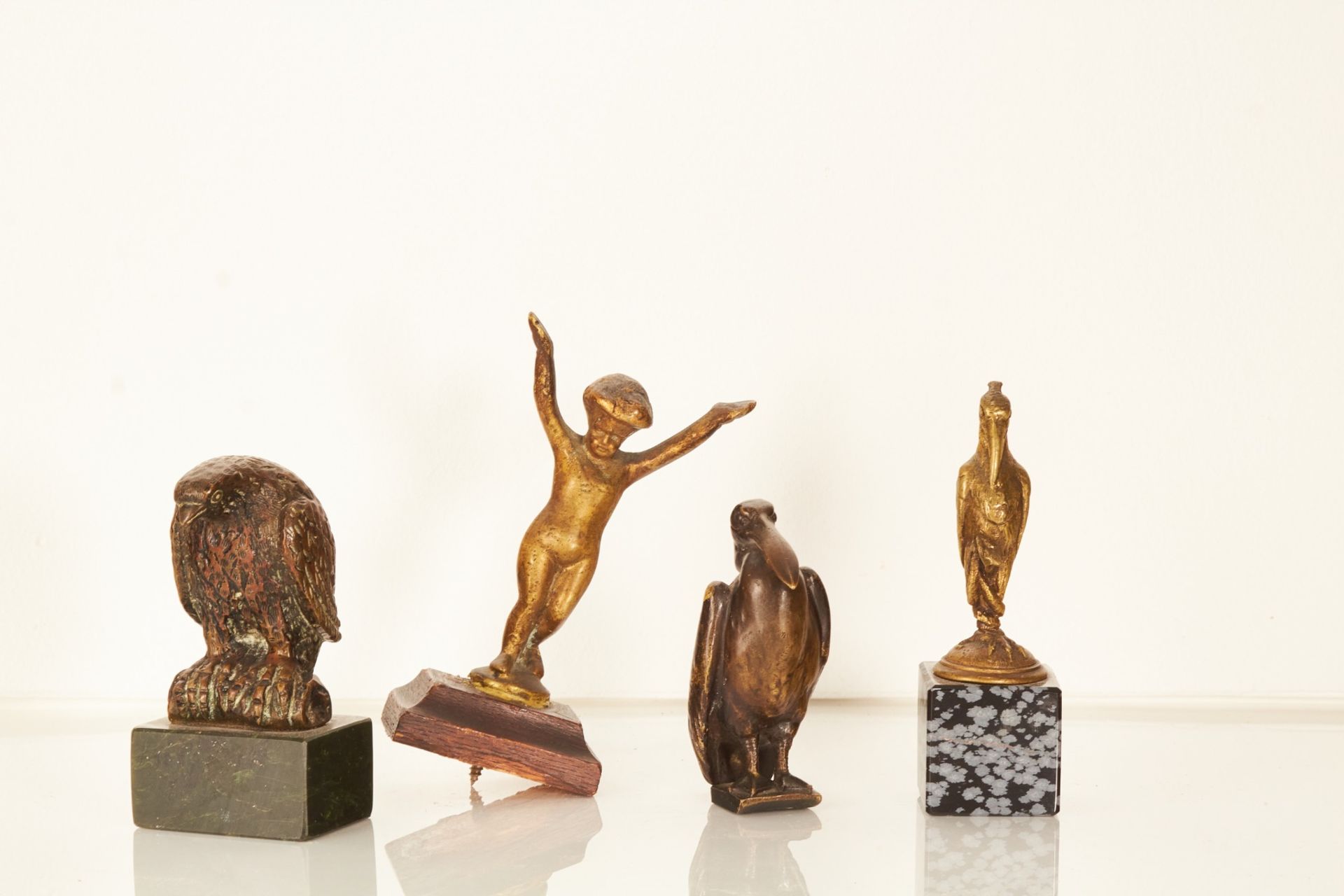 A small collection of bronze sculpture ornaments