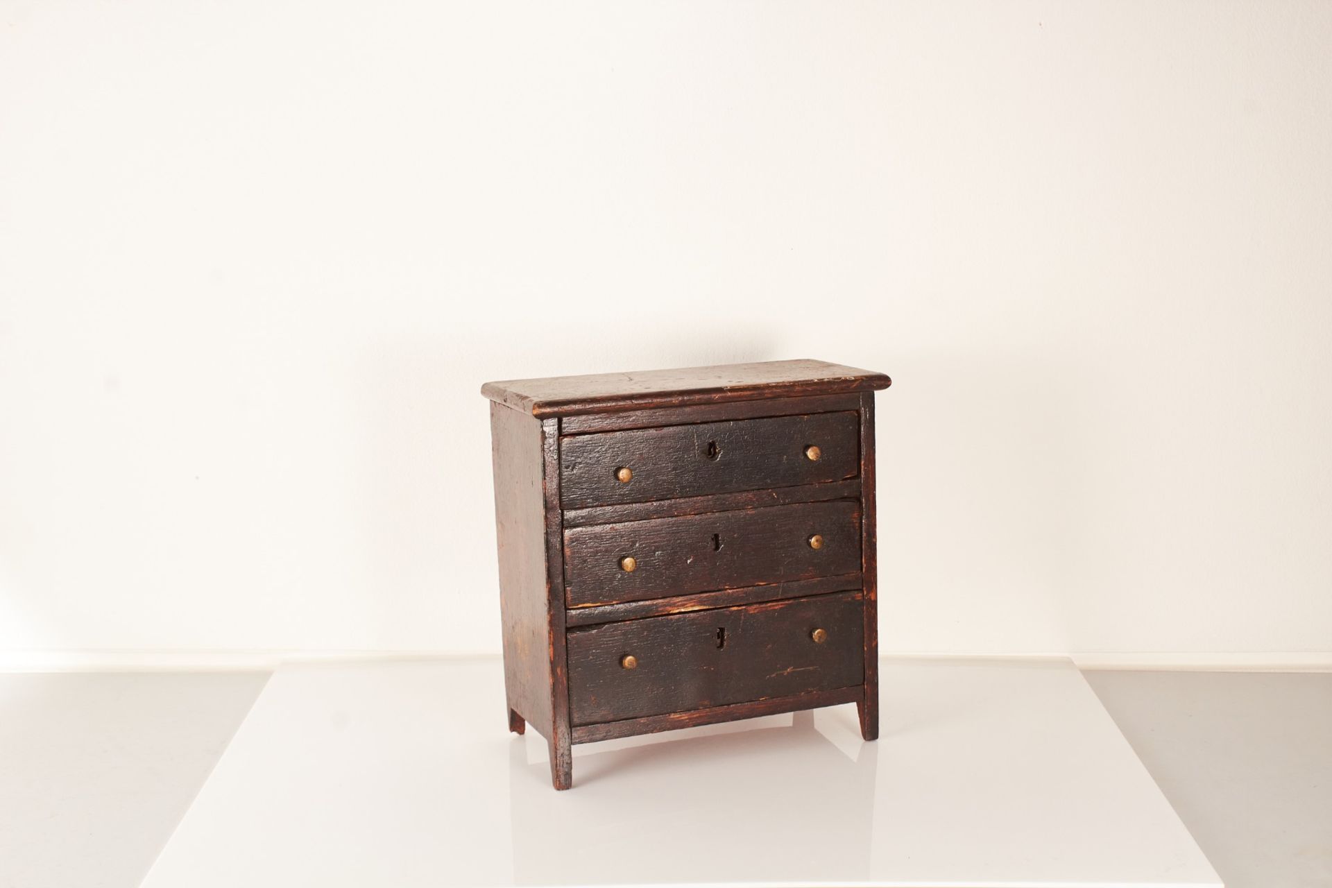 A mid to late 19th century stained oak miniature or ‘apprentice’ chest of drawers, English circa 188