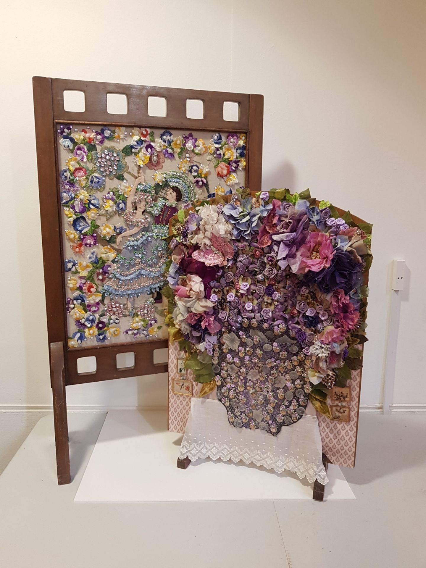 TWO VINTAGE OAK FIRE SCREENS WITH LATER APPLIQUE DECORATION