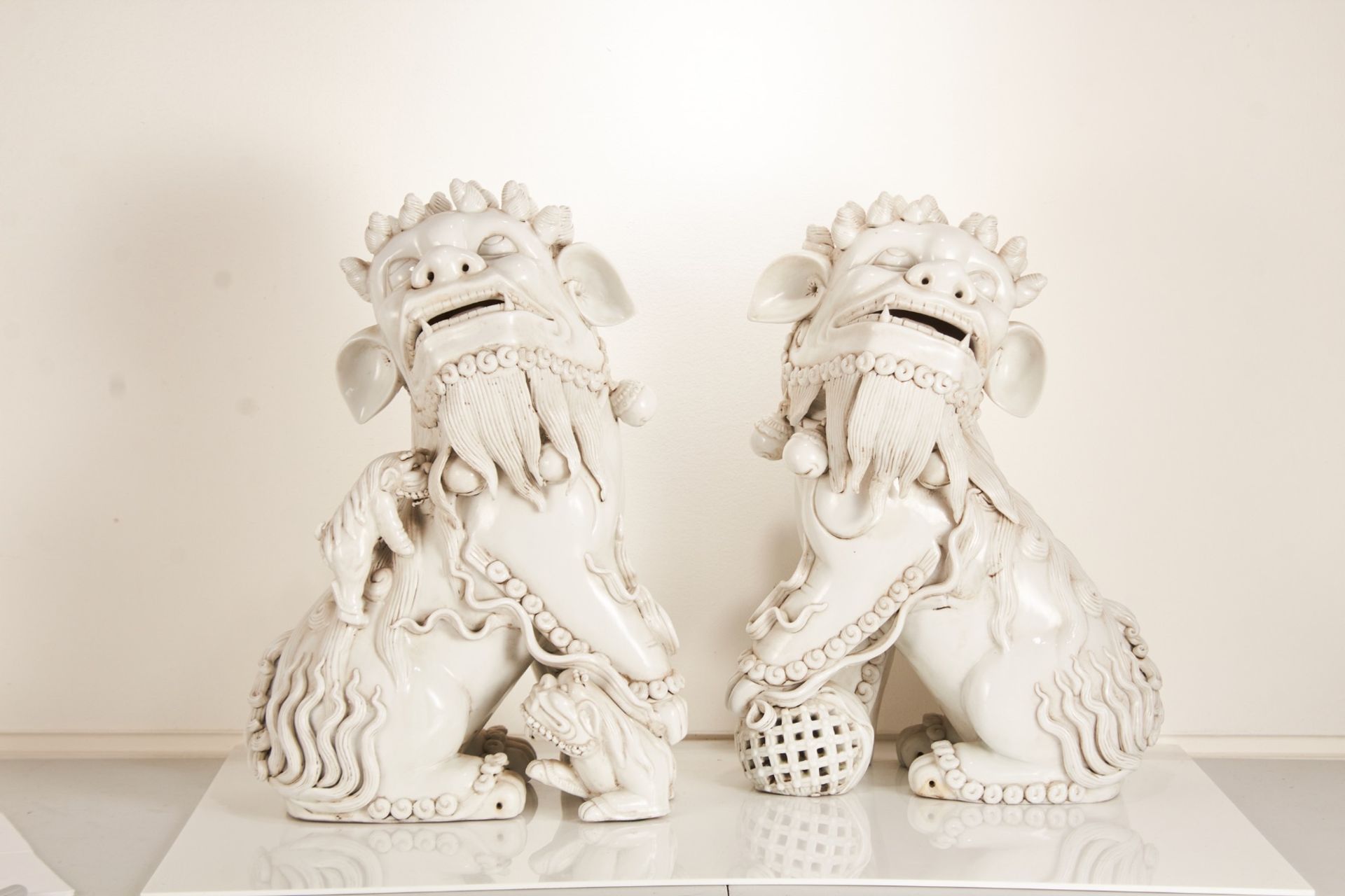 A pair of late-20th century Chinese porcelain blanc-de-chine Foo dogs or lion dog