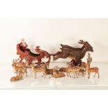 A mid-20th century die-cast model of Santa’s sleigh and two reindeer