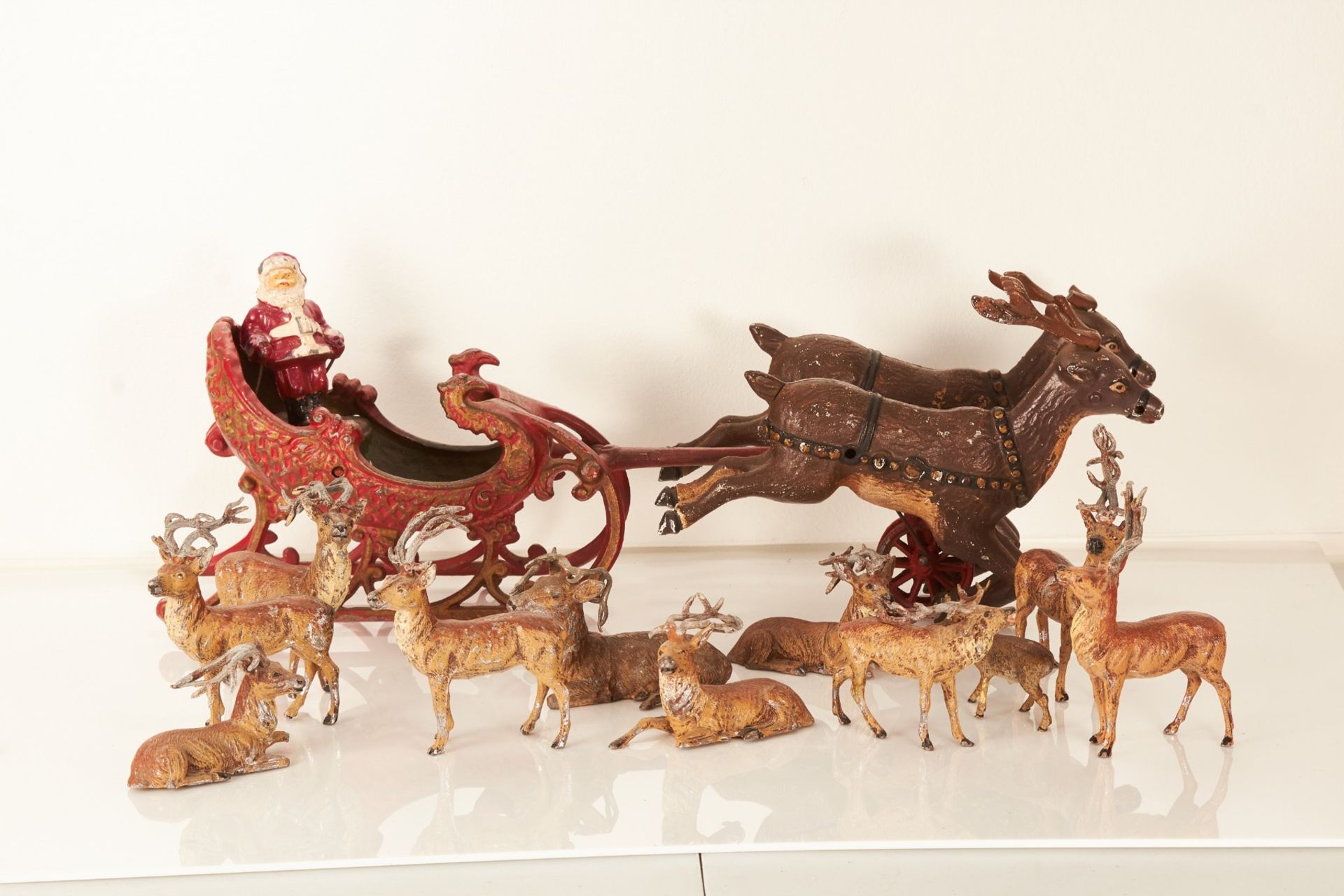 A mid-20th century die-cast model of Santa’s sleigh and two reindeer