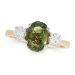 A GREEN SAPPHIRE AND DIAMOND THREE STONE RING in 18ct yellow gold, set with an oval cut green