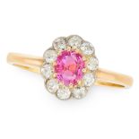 A RUBY AND DIAMOND CLUSTER in 18ct yellow gold and platinum, set with a oval cut ruby of 0.65 carats