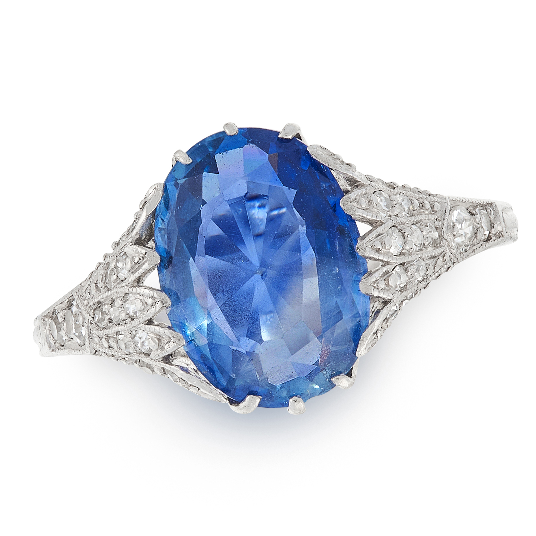 A SAPPHIRE AND DIAMOND DRESS RING in platinum, set with an oval cut sapphire of 3.51 carats accented