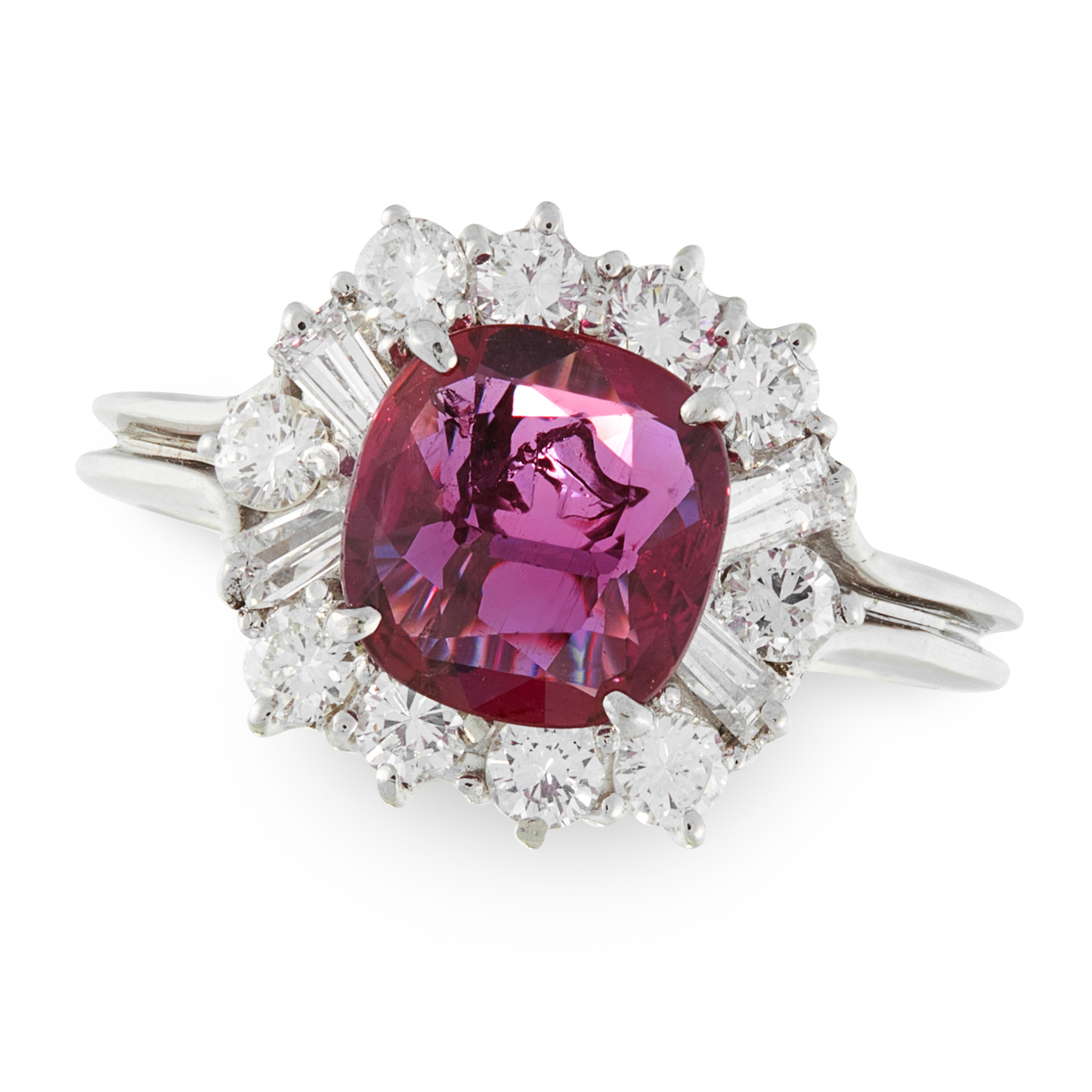 A RUBY AND DIAMOND CLUSTER RING in 18ct white gold, set with a cushion cut ruby of 1.22 carats