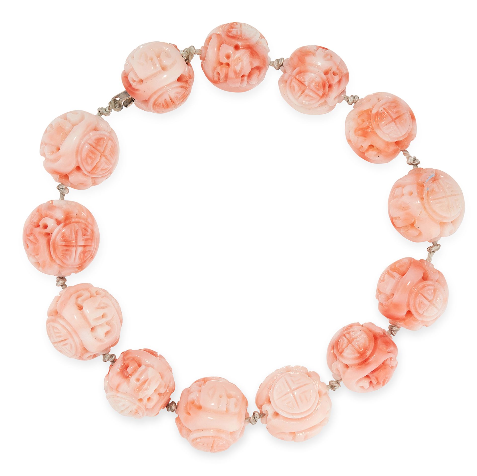 A CHINESE CARVED CORAL BEAD BRACELET comprising of a single row of thirteen carved coral beads