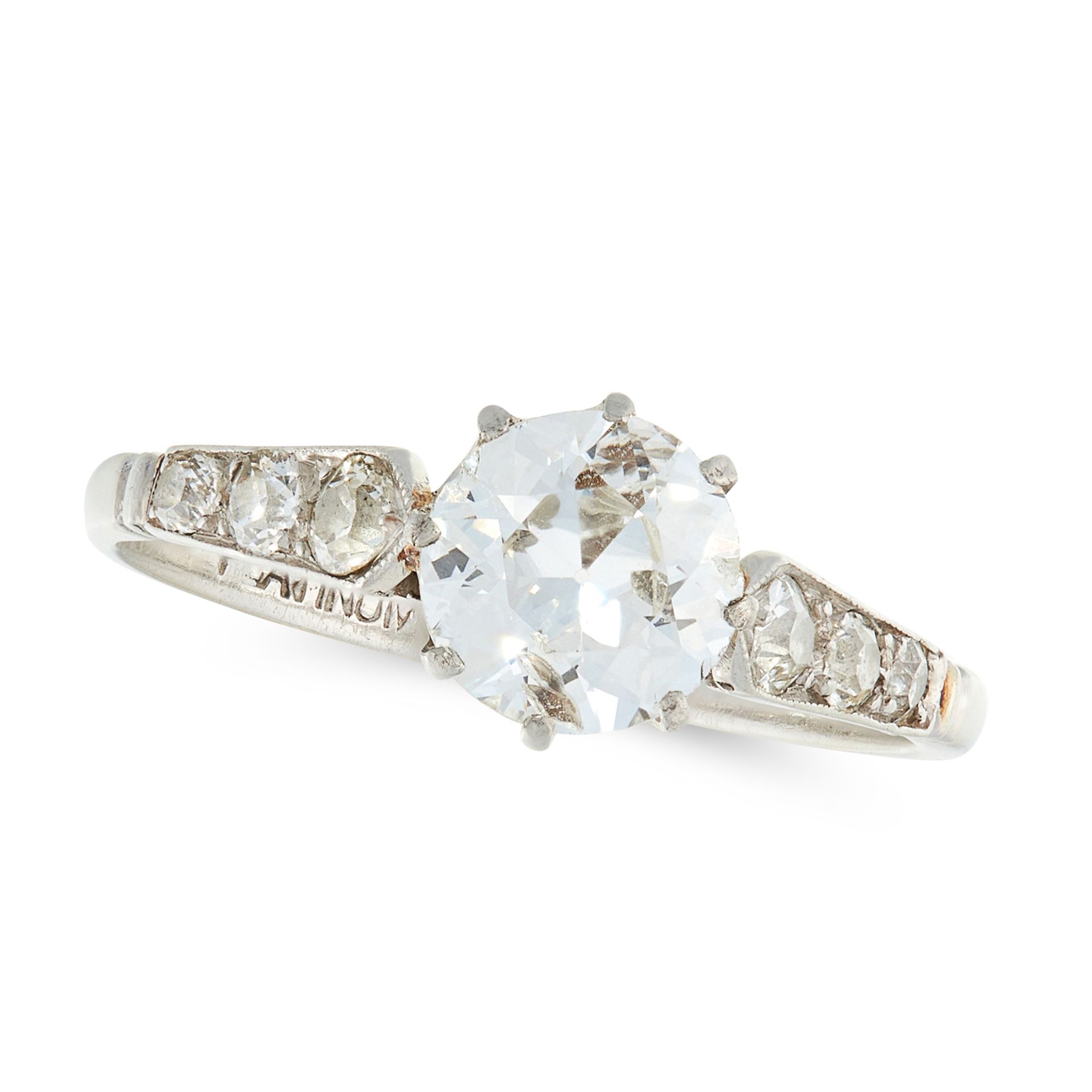 A SOLITAIRE DIAMOND RING, EARLY 20TH CENTURY in platinum, set with a central old cut diamond flanked