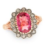 A PINK TOURMALINE AND DIAMOND DRESS RING in yellow gold and silver, set with a cushion shaped