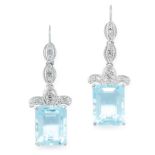 A PAIR OF BLUE TOPAZ AND DIAMOND EARRINGS in white gold, each set with an emerald cut blue topaz