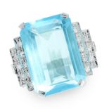 A BLUE TOPAZ AND DIAMOND RING in white gold, set with an emerald cut blue topaz of approximately
