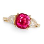 A RUBY AND DIAMOND RING in 18ct yellow gold, set with a cushion cut ruby of 1.30 carats between