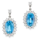 A PAIR OF AQUAMARINE AND DIAMOND EARRINGS in 18ct white gold, each set with an oval cut aquamarine