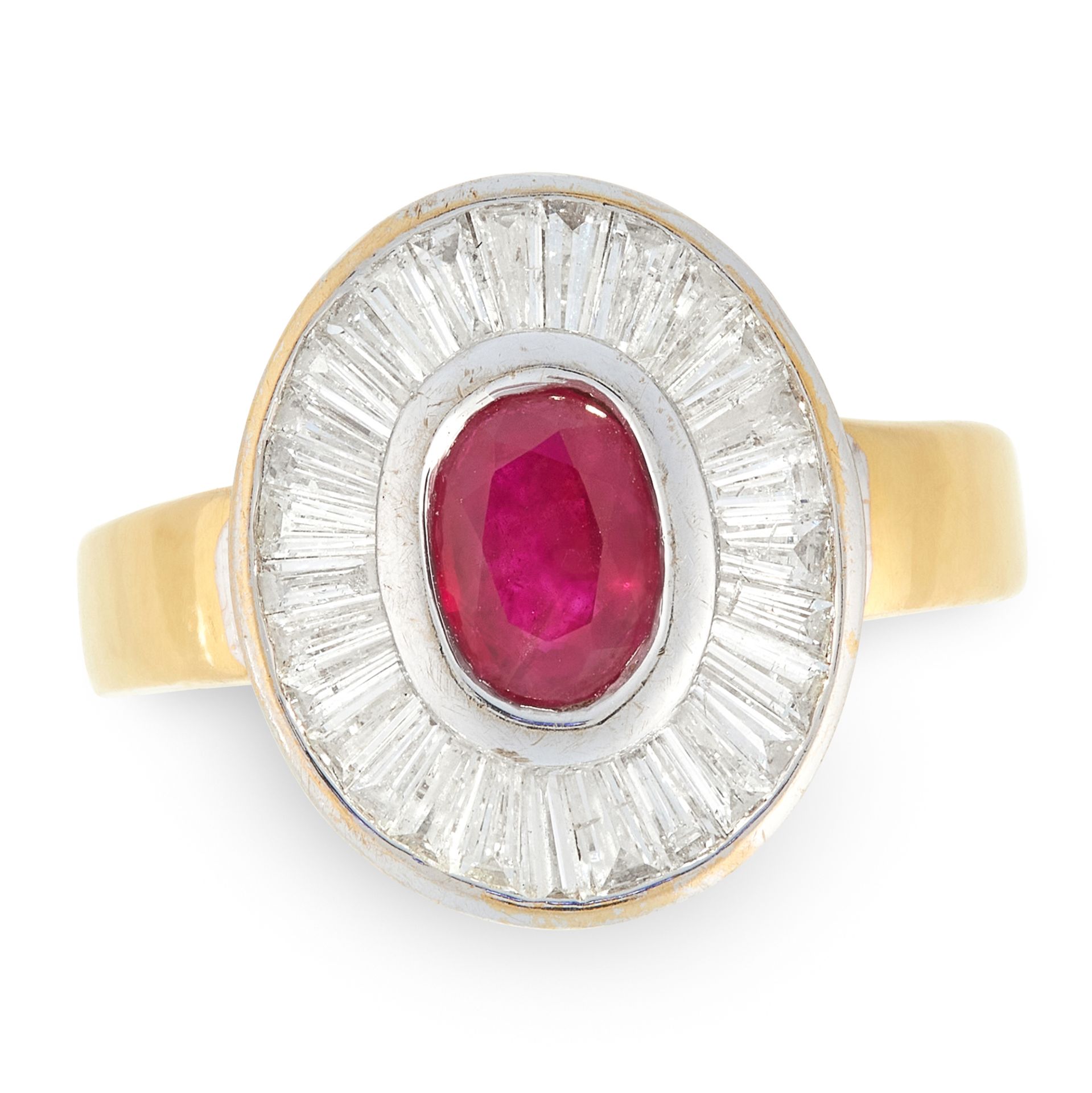 A RUBY AND DIAMOND CLUSTER RING in 18ct yellow and white gold, set with an oval cut ruby of 0.85