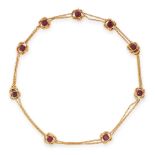 AN ANTIQUE GARNET NECKLACE in yellow gold, comprising a row of nine cushion cut garnets within