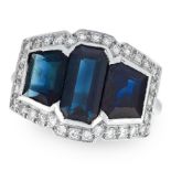 AN ART DECO SAPPHIRE AND DIAMOND DRESS RING in platinum, set with three step cut sapphires within