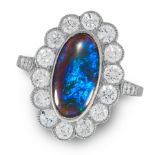 A BLACK OPAL AND DIAMOND CLUSTER RING in white gold or platinum, set with an oval cabochon black