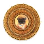 AN ANTIQUE REVERSE INTAGLIO HAIRWORK MOURNING BROOCH in high carat yellow gold, set with a central