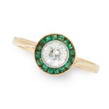 A DIAMOND AND EMERALD TARGET RING in high carat yellow gold, set with a round cut diamond of 0.50