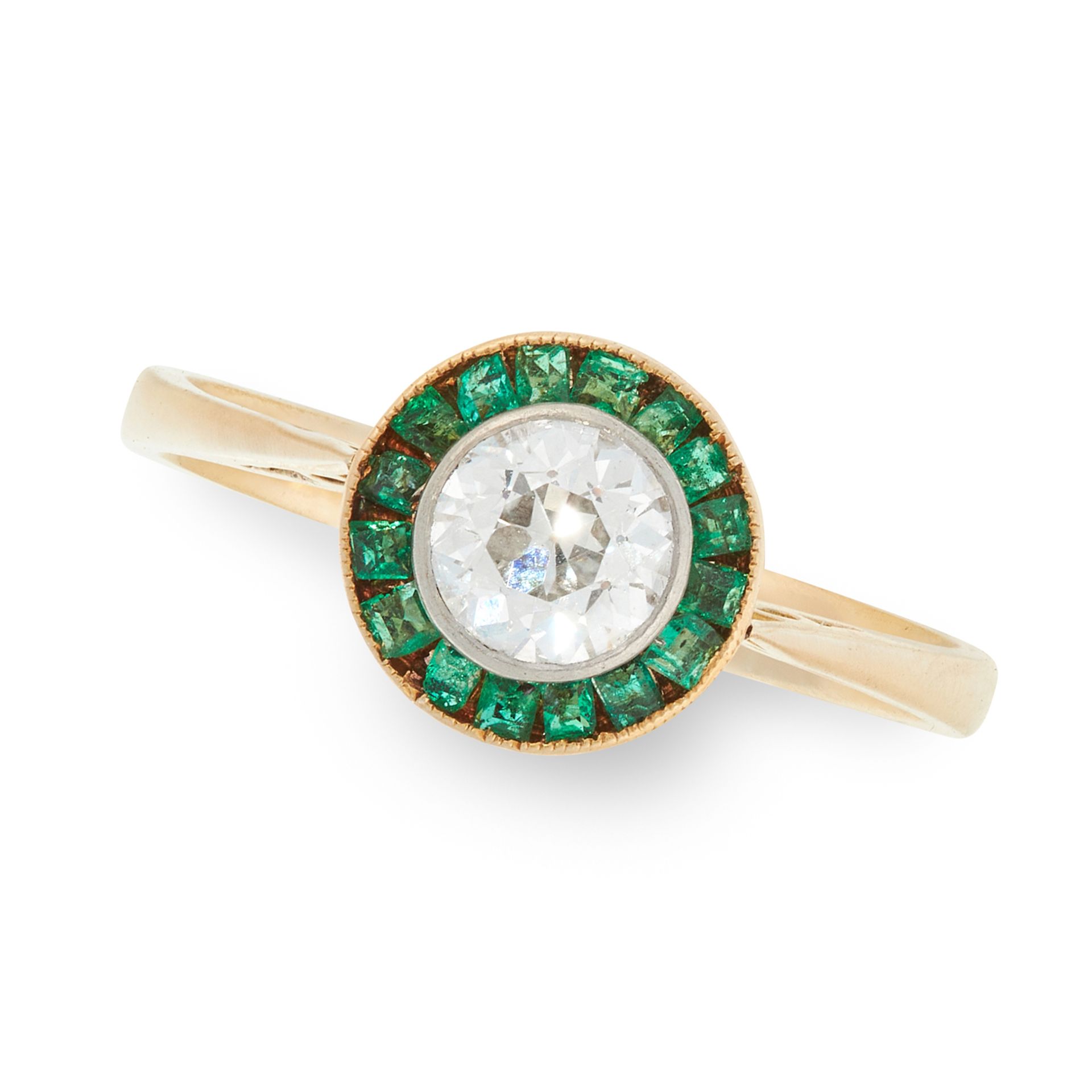 A DIAMOND AND EMERALD TARGET RING in high carat yellow gold, set with a round cut diamond of 0.50