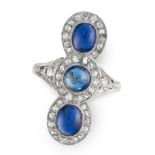 A SAPPHIRE AND DIAMOND DRESS RING in 18ct white gold and platinum, set with three cabochon sapphires