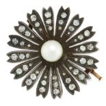 AN ANTIQUE PEARL AND DIAMOND FLOWER BROOCH in yellow gold and silver, designed as a flower, set at