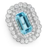 AN AQUAMARINE AND DIAMOND CLUSTER RING set with an emerald cut aquamarine of 8.26 carats within a