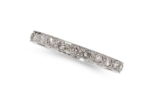 AN ART DECO DIAMOND ETERNITY BAND RING in platinum, set with a single row of round single cut